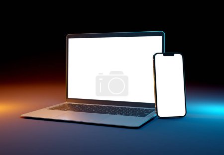 Photo for PARIS - France - March 15, 2023: Newly released Apple Macbook Air and Iphone 14, Silver color. Side view. 3d rendering laptop screen mockup on dark background - Royalty Free Image