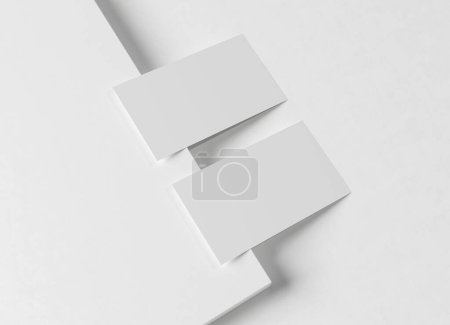 Téléchargez les photos : Deux maquettes de cartes de visite blanches. Modèle de carte d'appel texturé sur une surface carrée vierge. rendu 3D - en image libre de droit