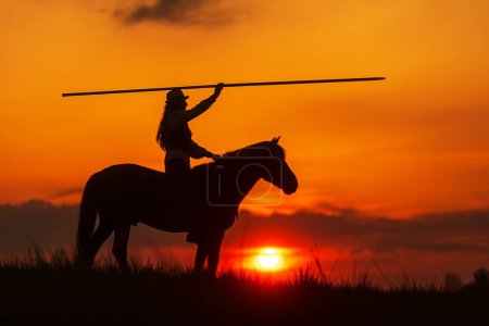 Photo for Silhouette of a rider on a horse with a spear - Royalty Free Image