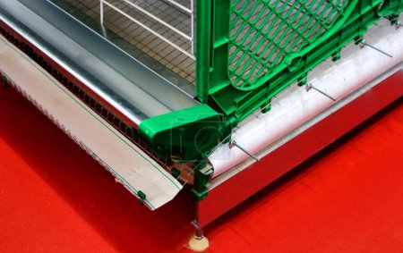 Foto de Close-up view of modern caged chicken farm equipment with auto feeders,agri business - Imagen libre de derechos