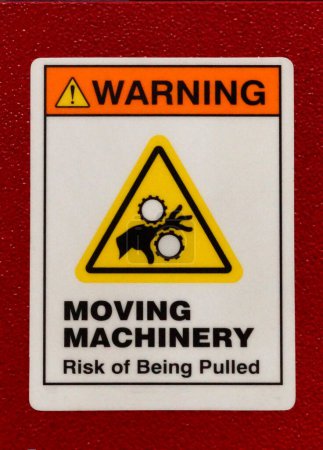Foto de View of Moving machinery safety warning sign - Imagen libre de derechos