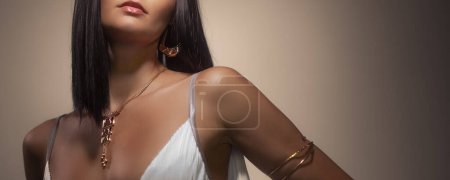 Photo for Beautiful girl with set jewelry. Woman in a necklace, earrings and a bracelet. Beauty and accessories. High quality photo - Royalty Free Image