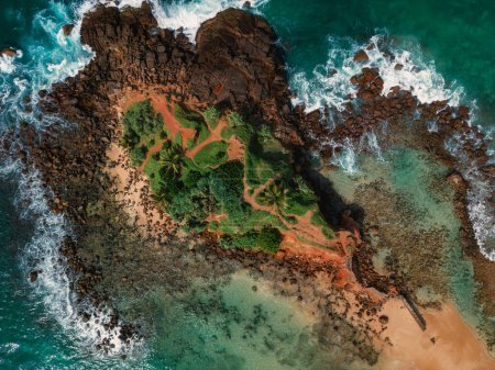 Photo for Scenic aerial drone view of Parrot rock - small island along the Mirissa Beach in Sri Lanka. Braking waves top view aerial photo from flying drone. Traveling and exotic countries concept. High quality - Royalty Free Image