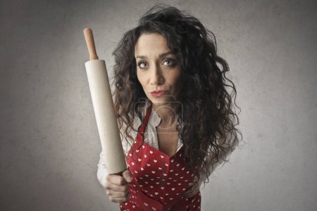 Photo for Portrait of woman with rolling pin in hand - Royalty Free Image
