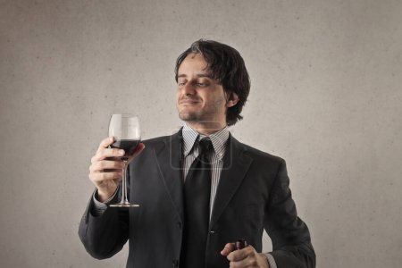 Photo for Man drinks a glass of wine - Royalty Free Image
