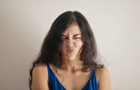 Photo for Portrait of young woman with expression of disgust - Royalty Free Image