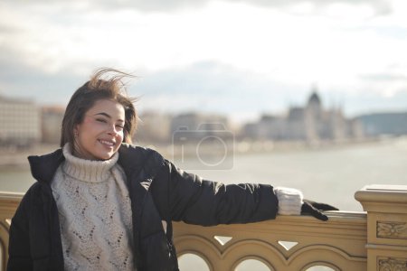 Photo for Young happy woman on a bridge in Budapest - Royalty Free Image