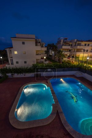 Photo for Illuminated swimming pools at night - Royalty Free Image