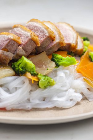 Photo for Baked duck breast with vegetables and rice noodles - Royalty Free Image
