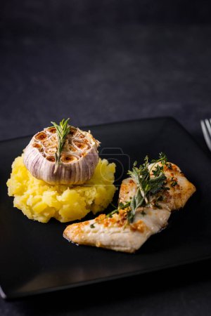 Photo for Cod fillet with couscous and roasted garlic - Royalty Free Image