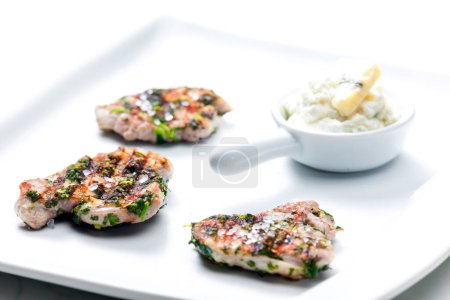 Photo for Grilled poultry meat with herbs served with blue cheese dip - Royalty Free Image