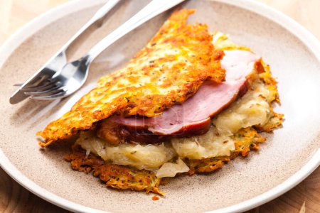 Photo for Potato cakes with smoked meat and sour cabbage - Royalty Free Image