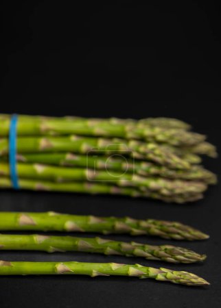Photo for Green asparagus on black background - Royalty Free Image