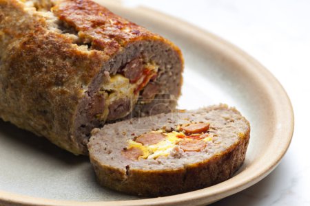 Foto de Homemade meat loaf filled with egg and sausage - Imagen libre de derechos