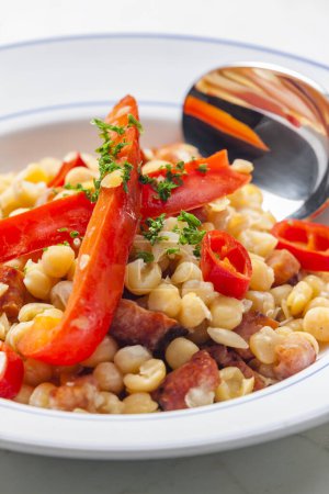 Photo for Mixture of yellow peas and bacon served with red pepper and chilli - Royalty Free Image