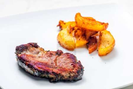 Photo for Pork steak with fried potatoes - Royalty Free Image