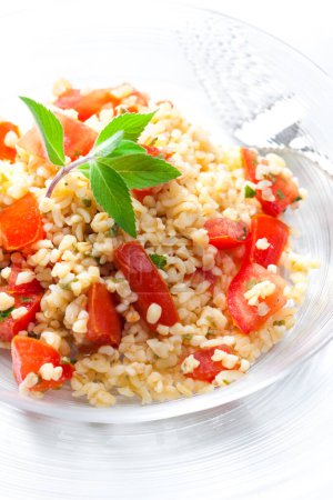 Photo for Bulgur salad with tomatoes and mint - Royalty Free Image