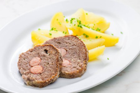homemade meat loaf filled with sausage