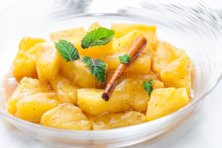 Photo for Pineapple compote with cinnamon and mint - Royalty Free Image