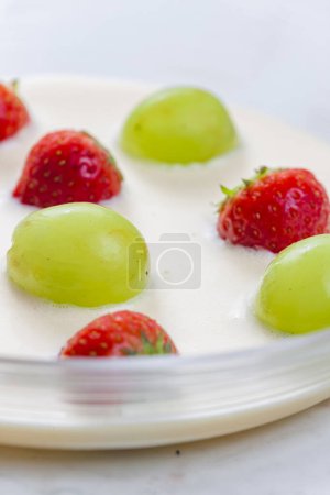 Photo for Summer soup with strawberries and grapes - Royalty Free Image