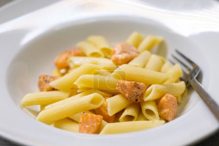 Photo for Pasta penne with salmon and lemon sauce - Royalty Free Image