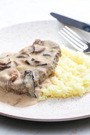 Photo for Meat with mushroom sauce and white rice - Royalty Free Image