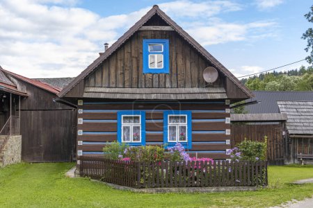 Photo for Old wooden houses in village Osturna, Spiska magura region, Slovakia - Royalty Free Image