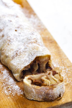 Photo for Apple strudel on wooden board - Royalty Free Image