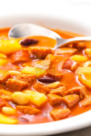 Photo for Sausage goulash soup with potatoes and beans - Royalty Free Image