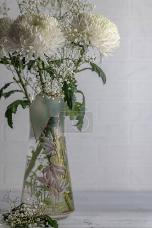 Photo for Bouquet of white chrysanthemums and gypsophila paniculata - Royalty Free Image