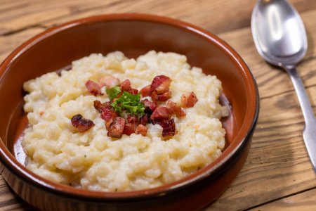 Photo for Slovakian halusky served with sheep cheese and roasted bacon - Royalty Free Image