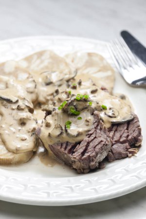 Photo for Beef meat with mushroom sauce and dumplings - Royalty Free Image