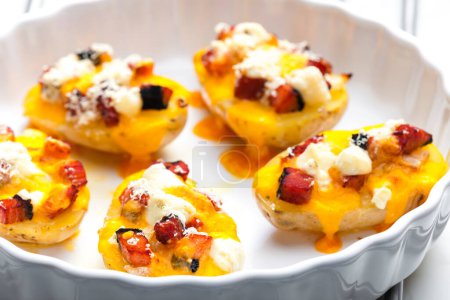 Photo for Baked potatoes filled with cheese and bacon - Royalty Free Image