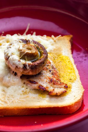 Photo for Slice of  toast bread grilled with meat, champignon and cheese - Royalty Free Image
