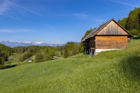 Photo for Typical wooden log cabins in Gorjuse, Triglavski national park, Slovenia - Royalty Free Image