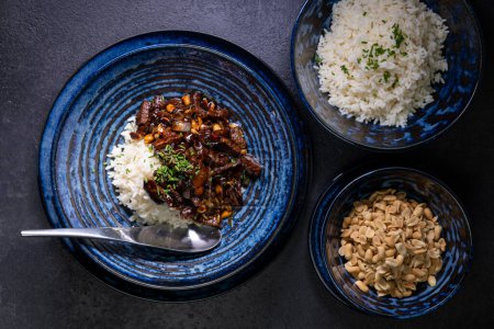 Photo for Beef kung pao with peanuts and rice - Royalty Free Image