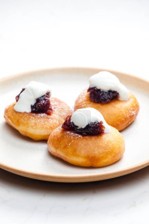 Photo for Fried muffins with plum jam and sour cream - Royalty Free Image