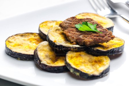 Photo for Meat in breadcrumbs with grilled aubergine - Royalty Free Image