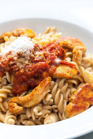 Photo for Pasta fusilli with spicy chicken meat and tomato sauce - Royalty Free Image