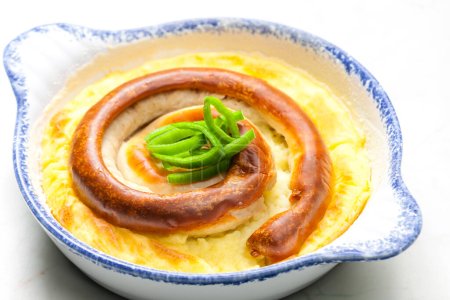 Photo for Sausage baked with mashed potatoes - Royalty Free Image