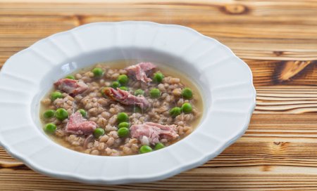 Photo for Smoked meat with groats and green peas - Royalty Free Image
