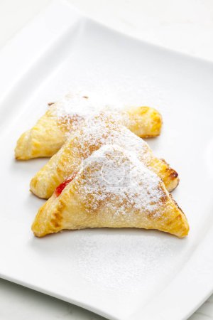 Photo for Homemade puff pastry filled with strawberry jam - Royalty Free Image