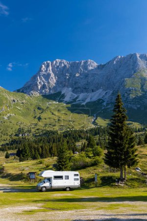 Photo for Caravan in summer mountain landscape, Alps, Italy - Royalty Free Image