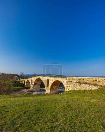 Photo for Pont Julien, roman stone arch bridge over Calavon river, Provence, France - Royalty Free Image