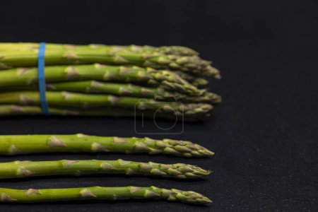 Photo for Green asparagus on black background - Royalty Free Image