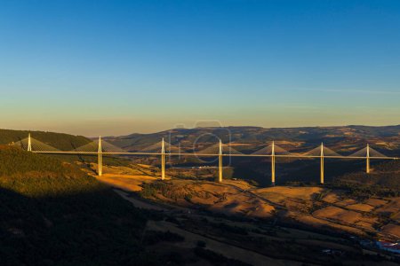 Photo for Multi-span cable stayed Millau Viaduct across gorge valley of Tarn River, Aveyron Departement, France - Royalty Free Image