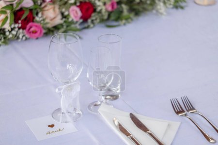 Photo for Wedding table with detail of glasses, cutlery and signs with name tags in the Czech language - Royalty Free Image
