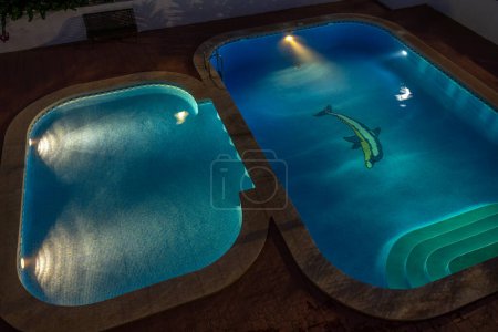 Photo for Illuminated swimming pool at night - Royalty Free Image