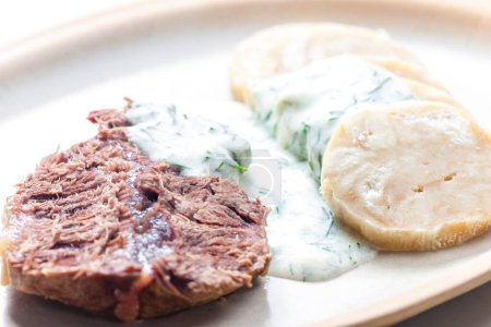 Photo for Beef meat with dill sauce and dumplings - Royalty Free Image