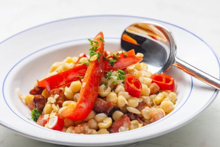 Photo for Mixture of yellow peas and bacon served with red pepper and chilli - Royalty Free Image